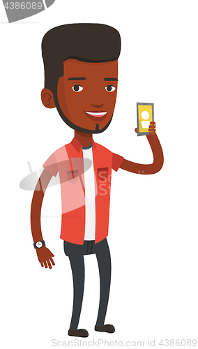 Image of Man holding ringing mobile phone.