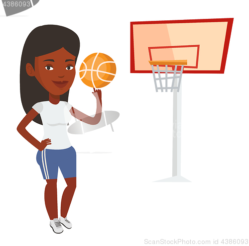 Image of Young basketball player spinning ball.