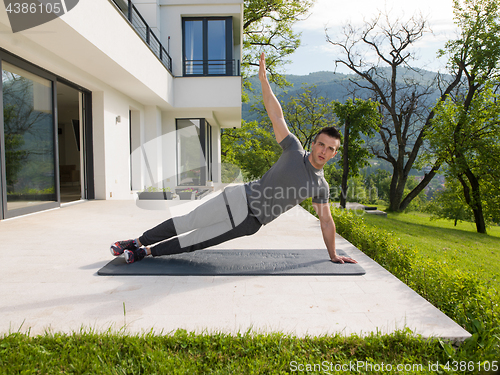 Image of man doing morning yoga exercises