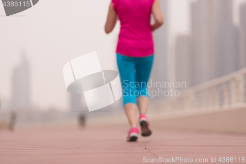 Image of woman running on the promenade