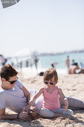 Image of Mom and daughter on the beach
