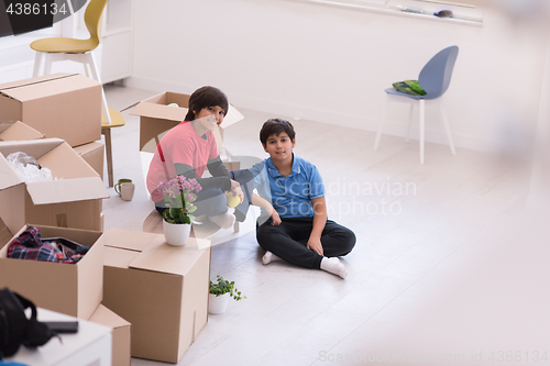 Image of boys with cardboard boxes around them