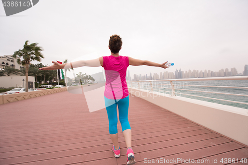 Image of young woman celebrating a successful training run