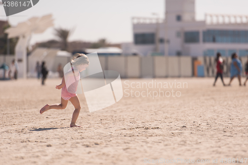 Image of little cute girl at beach