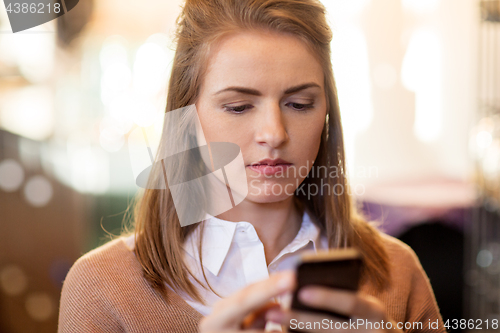 Image of close up of young woman with smartphone