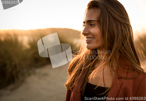 Image of Portrait of a beautiful woman on the beach