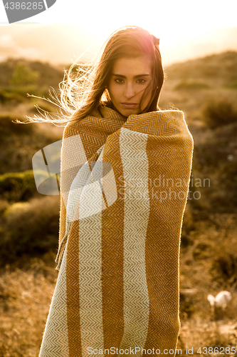 Image of Beautiful woman wrapped in a wool towel