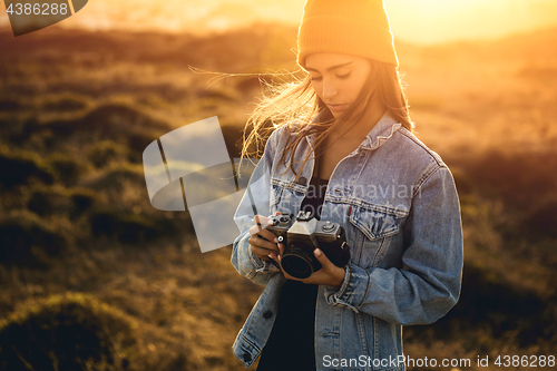 Image of Woman Taking Picture Outdoors