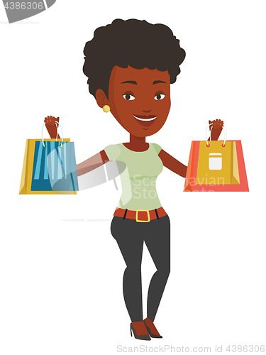 Image of Happy woman holding shopping bags.