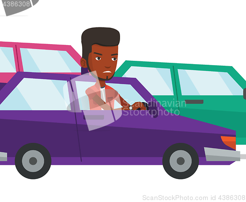 Image of Angry african man in car stuck in traffic jam.