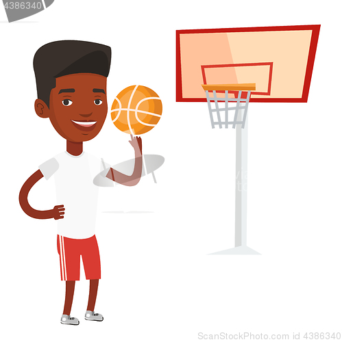 Image of Young basketball player spinning ball.