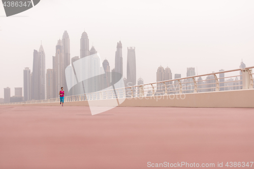 Image of woman running on the promenade