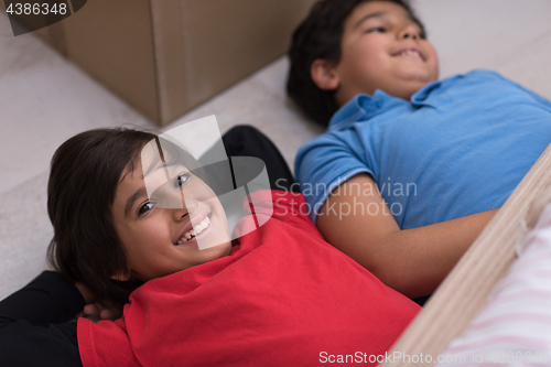 Image of young boys having fun on the floor