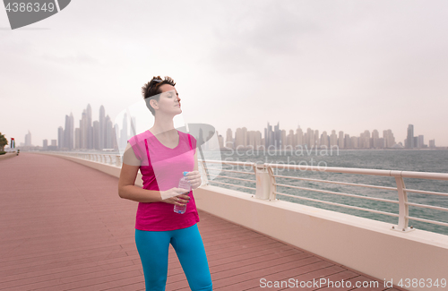 Image of young woman celebrating a successful training run