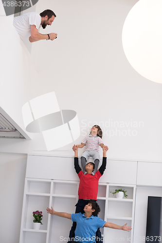 Image of young boys posing line up piggyback