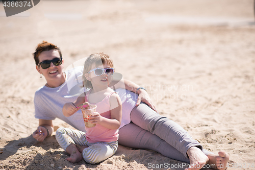 Image of Mom and daughter on the beach