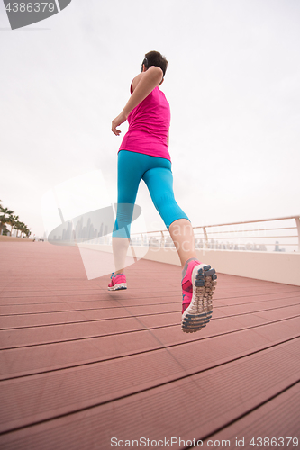 Image of woman running on the promenade