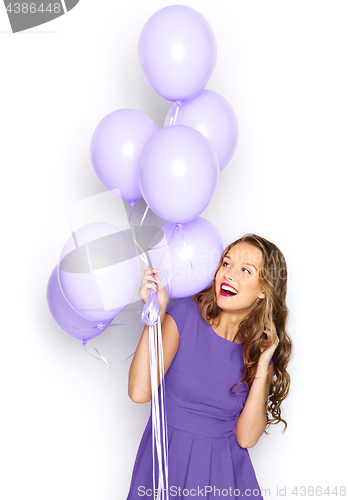 Image of happy girl in ultra violet dress with balloons