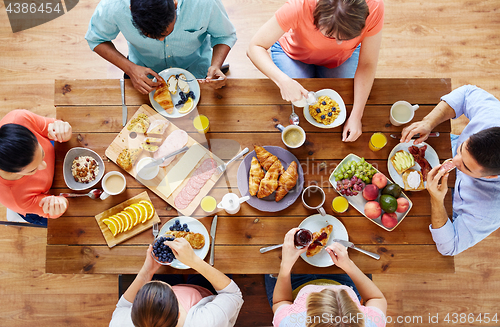 Image of group of people having breakfast at table