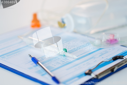 Image of close up of medical report and drop counter