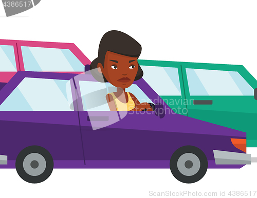 Image of Angry african woman in car stuck in traffic jam.