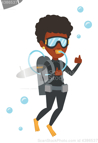 Image of Woman diving with scuba and showing ok sign.