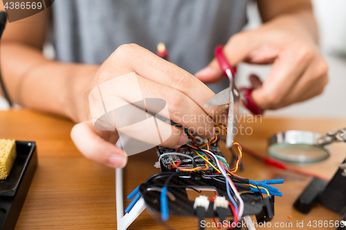 Image of Cutting wire on drone board