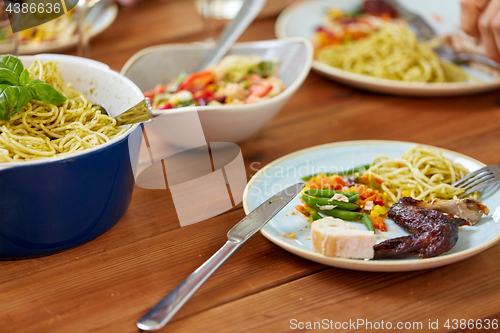 Image of plate with food on wooden table