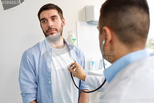 Image of doctor with stethoscope and patient at hospital