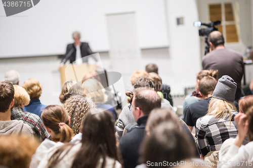 Image of Business speaker giving a talk at business conference event.