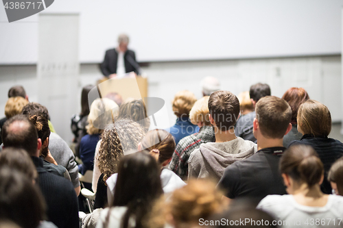 Image of Business speaker giving a talk at business conference event.