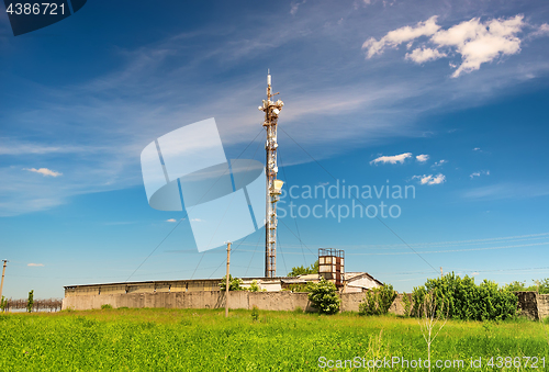 Image of TV tower on green field