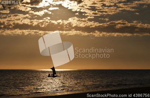 Image of Silhouette of a boat (fishing pirogue) at sea. Madagascar