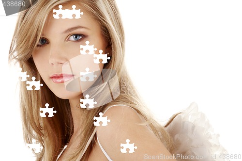 Image of sad blue-eyed angel puzzle portrait