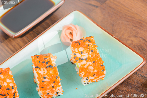 Image of California maki sushi with masago, top view