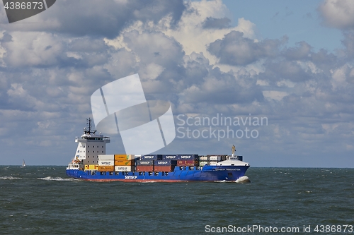 Image of Ship carrying containers onboard