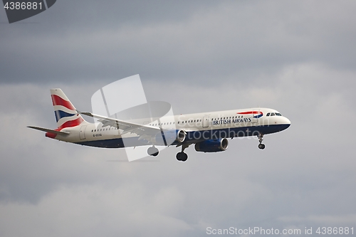 Image of Plane landing in cloudy weather