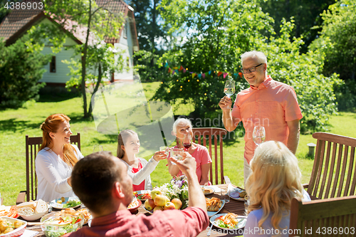 Image of family gathering at summer garden and celebration