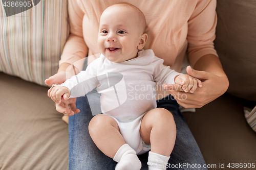 Image of mother with happy little baby boy at home