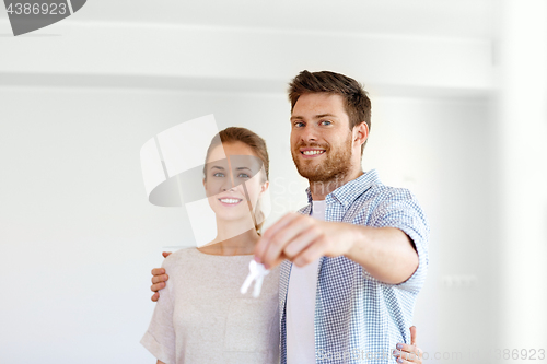 Image of happy couple with keys of new home