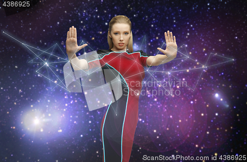 Image of futuristic woman over planet and stars in space