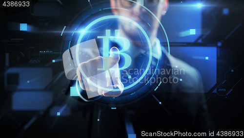 Image of close up of businessman with bitcoin hologram