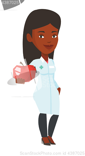 Image of Nutritionist offering fresh red apple.