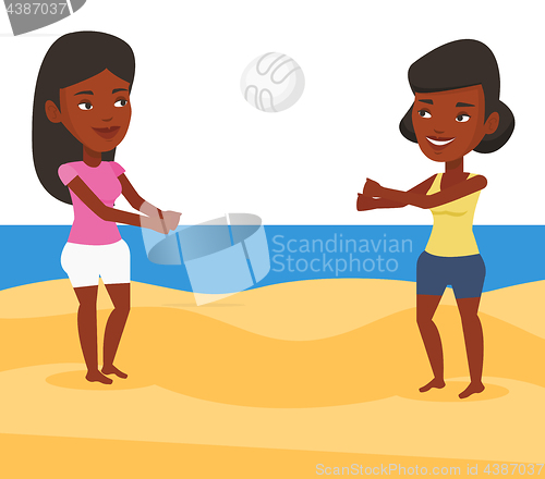 Image of Two women playing beach volleyball.