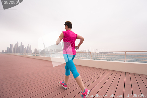 Image of woman running on the promenade