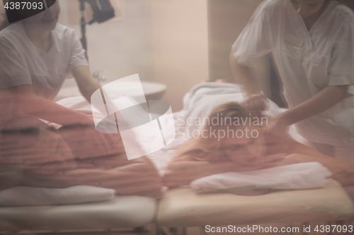 Image of couple receiving a back massage