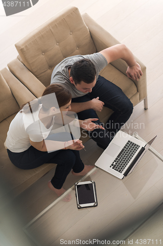 Image of happy young couple buying online