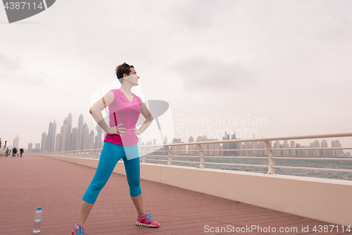 Image of woman stretching and warming up