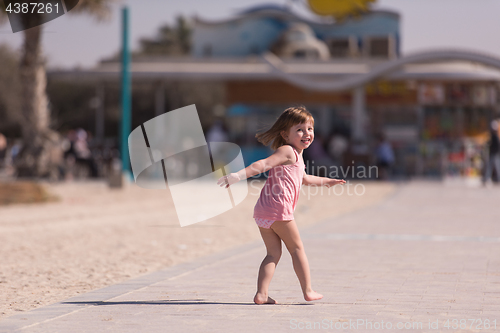 Image of little cute girl at beach