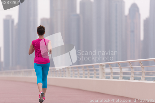 Image of woman running on the promenade